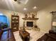 Inviting living room showcases a stone fireplace and cozy seating arrangement at 1370 Jane Lacey Ln, New Smyrna Beach, FL 32168