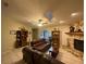 Comfortable living room with a stone fireplace and plush leather seating at 1370 Jane Lacey Ln, New Smyrna Beach, FL 32168