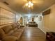 Open living room featuring a fan, art pieces, and comfortable seating at 1370 Jane Lacey Ln, New Smyrna Beach, FL 32168