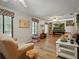 Spacious living room with hardwood floors, built-in shelving, fireplace, and multiple windows at 1370 Jane Lacey Ln, New Smyrna Beach, FL 32168