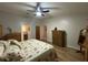 Cozy main bedroom with hardwood floors, comfortable bed, and ample dresser storage at 1370 Jane Lacey Ln, New Smyrna Beach, FL 32168