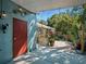 The covered patio features brick flooring, a partial enclosure, and access to the outdoor garden at 1370 Jane Lacey Ln, New Smyrna Beach, FL 32168