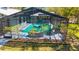 Screened pool with inviting turquoise water and lush landscaping in a backyard oasis at 1370 Jane Lacey Ln, New Smyrna Beach, FL 32168