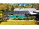 Enjoy a large screened in pool and patio for outdoor entertaining at 1370 Jane Lacey Ln, New Smyrna Beach, FL 32168