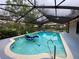 Covered pool area with large pool and play equipment for the whole Gathering at 1370 Jane Lacey Ln, New Smyrna Beach, FL 32168