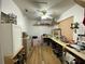 Functional room with ample storage space, long countertops, shelving, and a ceiling fan at 1370 Jane Lacey Ln, New Smyrna Beach, FL 32168