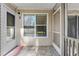 Cozy entryway with tiled floor, neutral paint, and a welcoming doormat at 1600 Big Tree Rd # G3, South Daytona, FL 32119