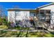 Condo exterior showing neat landscaping, a private entrance, and well-lit pathway at 1600 Big Tree Rd # G3, South Daytona, FL 32119