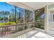 Relaxing screened patio showcasing views of the serene pond and natural surroundings at 1600 Big Tree Rd # G3, South Daytona, FL 32119