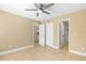 A bedroom featuring neutral walls, tile flooring, and closet doors at 1600 Big Tree Rd # I2, South Daytona, FL 32119