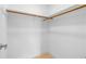 A walk-in closet with white walls, carpet flooring and a wood closet rod at 1600 Big Tree Rd # I2, South Daytona, FL 32119