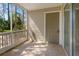 Enclosed screened porch with views of trees and exterior door leading to the outdoors at 1600 Big Tree Rd # I2, South Daytona, FL 32119