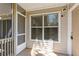 Outdoor porch with window, door, and screen to enjoy scenic outdoor views at 1600 Big Tree Rd # I2, South Daytona, FL 32119