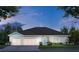 Charming single-story home featuring a two-car garage, stone accents, and a beautifully landscaped front yard at 1911 Lime Tree Dr, Edgewater, FL 32141