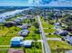 Scenic aerial shot showcasing houses along the street in a waterfront community with lush greenery at 2019 S Riverside, Edgewater, FL 32141