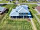 Charming home boasts an inviting backyard with screened porch and landscaping at 2019 S Riverside, Edgewater, FL 32141