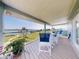 A spacious balcony with seating that offers tranquil waterfront views at 2019 S Riverside, Edgewater, FL 32141