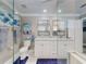 Bathroom with double sinks, a glass enclosed shower, and white cabinets at 2019 S Riverside, Edgewater, FL 32141