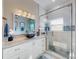 Bright bathroom with a glass shower and vanity with granite countertop and sink at 2019 S Riverside, Edgewater, FL 32141