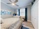 Stylish bedroom featuring a ceiling fan, warm wood floors, and ample closet space at 2019 S Riverside, Edgewater, FL 32141