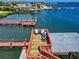Expansive dock with an upper deck featuring comfortable seating, ideal for relaxation and entertaining by the water at 2019 S Riverside, Edgewater, FL 32141