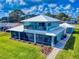 Beautiful two-story coastal home with a large screened patio and a second-story deck with a view at 2019 S Riverside, Edgewater, FL 32141