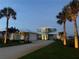 Beautiful home featuring a two-car garage, manicured lawn, and professional exterior lighting at 2019 S Riverside, Edgewater, FL 32141
