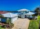 Stunning waterfront home with a two-car garage and a view of the water at 2019 S Riverside, Edgewater, FL 32141