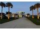 Inviting home featuring a long driveway, lush landscaping, and professional exterior lighting at 2019 S Riverside, Edgewater, FL 32141
