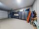Spacious garage with ample storage, shelving, and room for multiple vehicles and projects at 2019 S Riverside, Edgewater, FL 32141