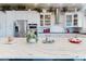 Bright kitchen boasts stainless appliances, quartz countertops, white cabinets, and an island with countertop decor at 2019 S Riverside, Edgewater, FL 32141