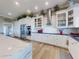 Modern kitchen with stainless appliances, and white cabinets with marble countertops and an island counter at 2019 S Riverside, Edgewater, FL 32141