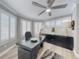 Well-lit home office featuring modern desk and ample windows at 2019 S Riverside, Edgewater, FL 32141