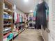 Large walk-in closet with custom shelving and wood floors at 2019 S Riverside, Edgewater, FL 32141