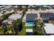 Aerial view of the property featuring a sparkling pool and backyard patio with inviting lounge area at 216 Kirkland Dr, New Smyrna Beach, FL 32169