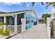 Spacious backyard with white fence, lush foliage, gravel, and an outdoor dining area at 216 Kirkland Dr, New Smyrna Beach, FL 32169