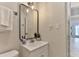 Cozy, well-lit bathroom featuring a stylish vanity, a mirror with modern lighting, and fresh white towels at 216 Kirkland Dr, New Smyrna Beach, FL 32169