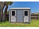 Outdoor beach access shed with two separate entrances for convenience and privacy at 216 Kirkland Dr, New Smyrna Beach, FL 32169