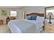 Comfortable bedroom featuring stylish decor, a wicker headboard, and ample natural light at 216 Kirkland Dr, New Smyrna Beach, FL 32169