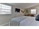 Serene bedroom with a flat-screen TV, desk, and beachy wall decorations at 216 Kirkland Dr, New Smyrna Beach, FL 32169
