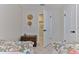 Comfortable bedroom with twin beds, a vintage trunk, and a view into a closet at 216 Kirkland Dr, New Smyrna Beach, FL 32169