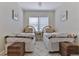 Bright bedroom featuring twin beds with rattan headboards, a table, and patterned bedspreads at 216 Kirkland Dr, New Smyrna Beach, FL 32169