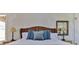 Relaxing bedroom with a plush bed, decorative wall art, and soft, natural light at 216 Kirkland Dr, New Smyrna Beach, FL 32169