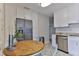 Contemporary kitchen featuring a stainless steel refrigerator, granite countertops, and a breakfast nook at 216 Kirkland Dr, New Smyrna Beach, FL 32169