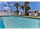 Inviting pool featuring clear blue water, lounge chairs, and a tidy storage shed at 216 Kirkland Dr, New Smyrna Beach, FL 32169