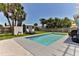 Private backyard with a sparkling swimming pool, lounge chairs, and lush landscaping at 216 Kirkland Dr, New Smyrna Beach, FL 32169
