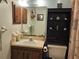 Bathroom featuring a vanity, mirror, built-in shelving and decorations at 2321 Tamarind Dr, Edgewater, FL 32141
