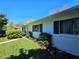 Exterior view shows well-maintained lawn and tidy landscaping along the side of the home at 2321 Tamarind Dr, Edgewater, FL 32141