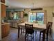 Eat-in kitchen featuring matching table and chairs plus updated cabinets and countertops at 2321 Tamarind Dr, Edgewater, FL 32141