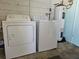 Laundry room with washing machine, dryer, and water heater; providing essential home appliances at 2321 Tamarind Dr, Edgewater, FL 32141
